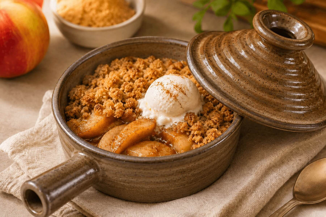 Apple crisp dessert in a ceramic microwave cooker topped with vanilla ice cream.