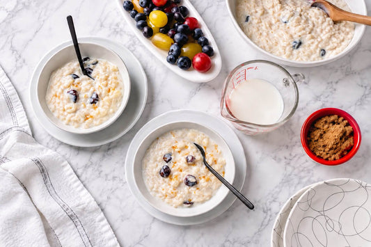 Creamy microwave rice pudding served with fruit, milk, and brown sugar